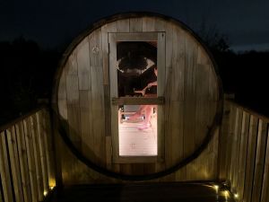 Inside the sauna at night at Birdholme Glamping.